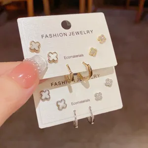 French minimalist four leaf clover stud and hoop earrings set, delicate fashion jewelry.
