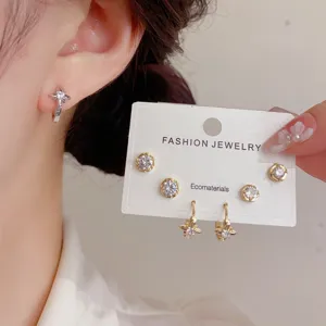 Detailed view of chic french luxury zircon star hoop and stud earrings set for women fashion.
