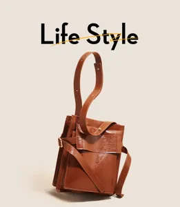 Retro commuter brown leather shoulder bag with structured multi-pocket design for women.