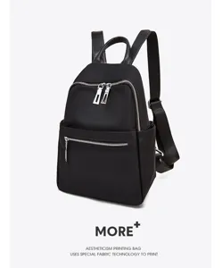 Classic black oxford cloth casual fashion backpack with multiple convenient zipper pockets.