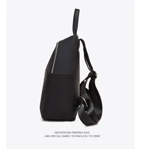 Side detail view of black oxford fabric backpack with smooth zipper and durable straps.