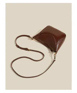 Brown oil wax leather women shoulder crossbody bag detail view, simple chic style daily use.