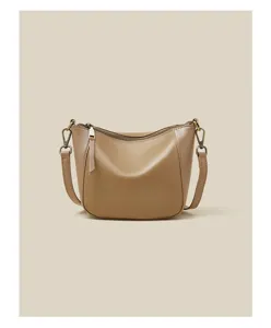 Genuine leather detail view of the minimalist casual shoulder bag with smooth oil wax texture.