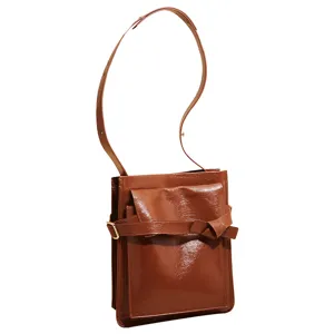 Retro brown patent leather shoulder bag for women, stylish commuter crossbody handbag.