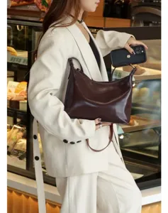 Stylish brown faux leather underarm shoulder bag for women, spacious and elegant.
