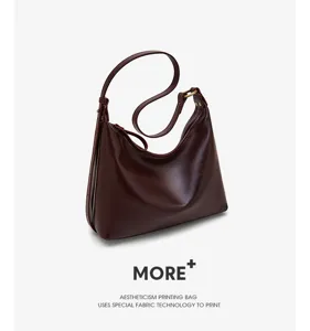 Detailed view of the dark brown leather hobo shoulder bag featuring smooth slouchy design.