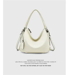Genuine leather hobo shoulder bag for women, stylish casual crossbody purse with metal hardware details.