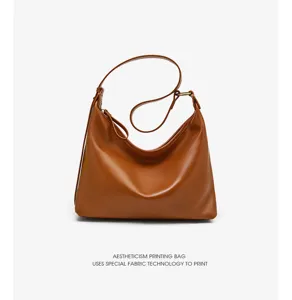 Brown leather hobo shoulder bag, casual underarm bag detail view showing smooth texture.