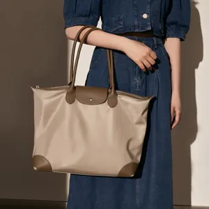 Waterproof nylon tote bag for women, large capacity shoulder bag, casual daily commuter handbag.