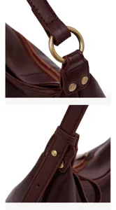 Detailed view of burgundy leather shoulder bag strap, metal ring and zipper craftsmanship.
