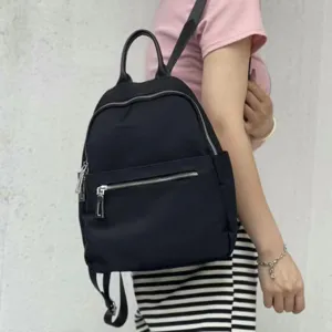 Classic black nylon backpack for women, casual daily school book bag with multiple pockets.