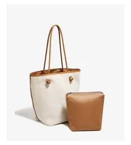 Chic woven tote bag with matching pouch, stylish commuter shoulder bag for daily casual wear.