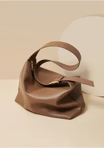Detailed view of the stylish brown soft leather hobo shoulder bag with smooth texture.
