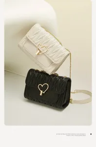Golden Fox high-end niche chain crossbody bag detail view, showing stylish black and white leather.