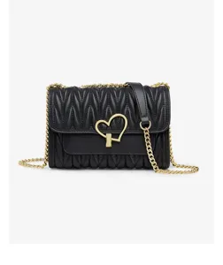 Black quilted leather shoulder bag detail showing gold chain strap and heart lock hardware.