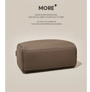 Detailed view of the stylish taupe Boston pillow bag, showing premium textured leather.