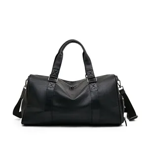 Men's black leather travel duffel bag, large capacity business commuting shoulder bag.