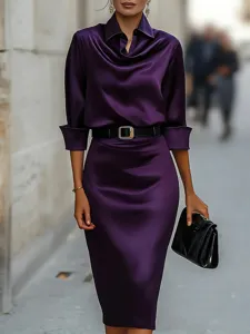 Detailed view of high-end purple satin long sleeve dress featuring elegant lapel and sleek black belt.
