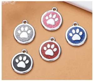 Cute round metal pet ID tag with paw print and glitter enamel design for dogs and cats.