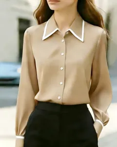 Detail view of the elegant contrast lapel long sleeve shirt in beige, soft and smooth fabric.