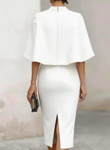 Back view detail of elegant white cape midi dress, slim fit pencil skirt with back slit zipper.