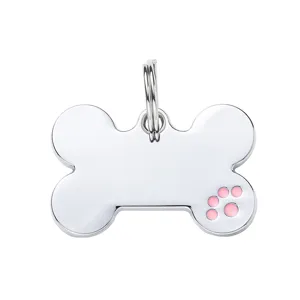 Silver metal bone pet ID tag with cute pink paw print enamel charm for dogs and cats.