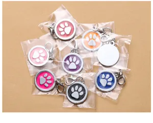 Round metal pet ID tags with colorful paw print design, durable zinc alloy dog tags for pets.