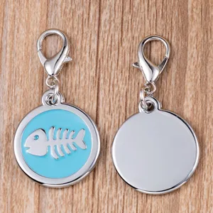 Round metal pet tag with blue fish skeleton design and lobster clasp, front and back view.