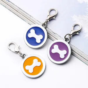 Round metal pet dog tag set with colorful enamel bone pendant and lobster clasp main view.