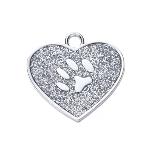 Heart-shaped pet ID tag with sparkling glitter and silver paw print for dogs and cats.