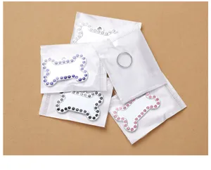 Rhinestone edge bone shaped pet ID tag detail, metal dog tag anti-lost pet accessories display.