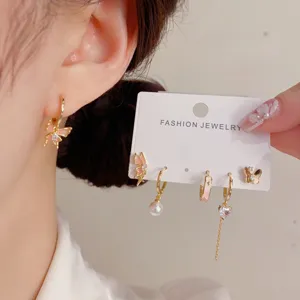 Chic gradient butterfly hoop earrings set, elegant detailed view of trendy Korean style jewelry.