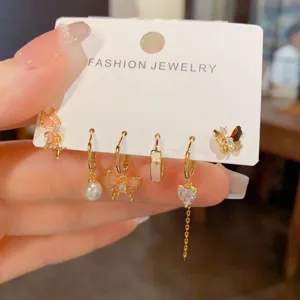 Gold plated butterfly hoop and stud earrings set featuring pearls and sparkling zirconia.