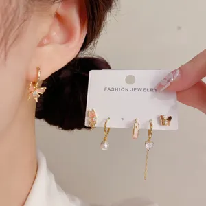 Gradient butterfly earring set, gold-tone hoop and stud earrings with sparkling cubic zirconia.