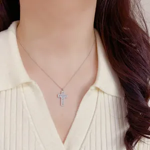 Delicate rhinestone cross necklace detail showcasing sparkling zircon stones and fine chain.