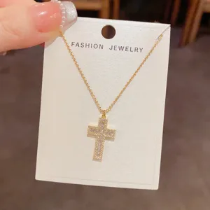 Exquisite gold cross pendant necklace with sparkling cubic zirconia design for daily wear.