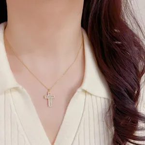 Exquisite French vintage zirconia cross necklace, delicate gold chain, elegant jewelry.