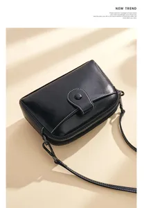 Black genuine leather crossbody bag, minimalist stylish shoulder bag with double zipper design.