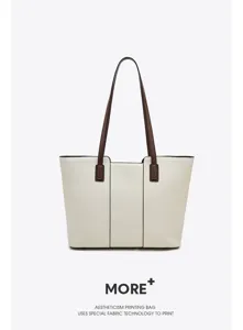 Detailed view of premium genuine leather tote bag featuring contrast brown shoulder straps.