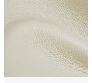 Detailed close-up of premium cream cowhide leather texture for women tote bag material quality.