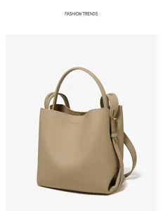Detailed view of the premium leather bucket bag featuring exquisite texture and handle.