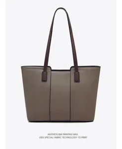 Detailed view of women's genuine leather tote bag, showing premium texture and stitching.