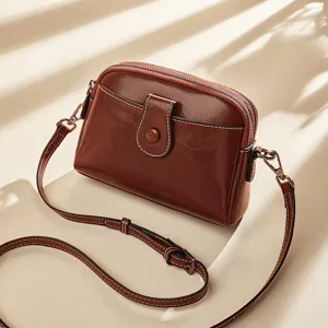 Vintage brown leather crossbody bag for women, simple and elegant single shoulder purse.