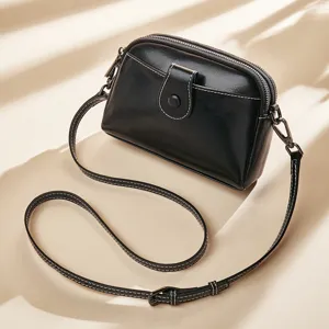 Black leather crossbody bag for women, simple casual single shoulder handbag with zipper.