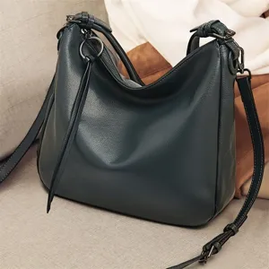 Dark green leather shoulder bag for women, stylish hobo crossbody tote with adjustable strap.
