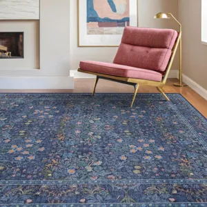Detail view of the vintage bohemian floral area rug with blue botanical pattern in room.