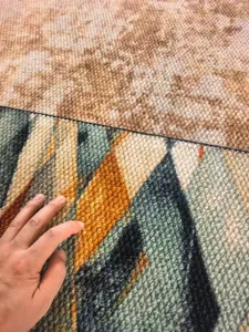 Detailed close-up view of the printed faux sisal loop pile carpet showcasing soft texture.