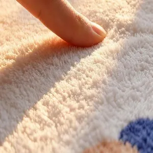 Plush rug close-up showing thick soft cashmere texture and cozy warm touch for home decor.