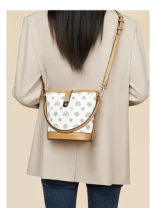 Elegant retro monogram bucket bag with adjustable strap and chic metal lock closure.