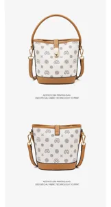 Close-up detail of the retro printed bucket bag showing special fabric and gold hardware.